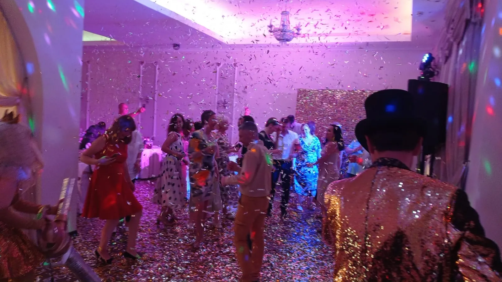 Confetti drop over a packed dance floor at a San Diego party