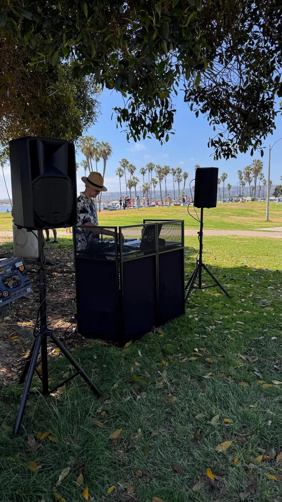 Professional DJ setup with controller, speakers and lighting at a San Diego event