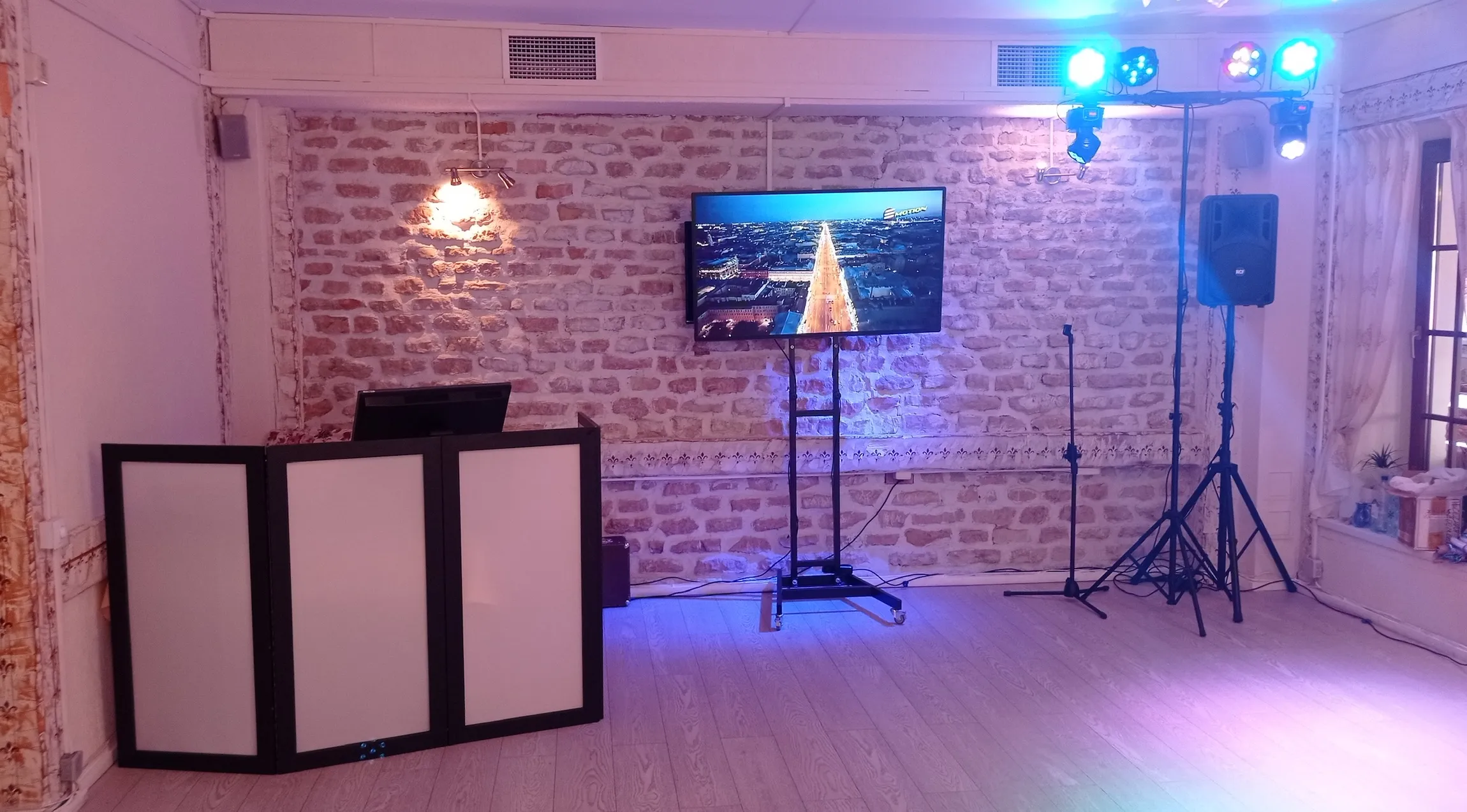 Karaoke setup with TV screen and lighting