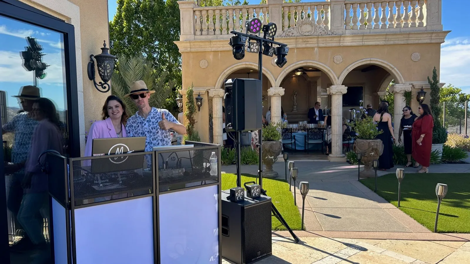 Rocket Karaoke's team at the DJ booth during a Poway estate wedding