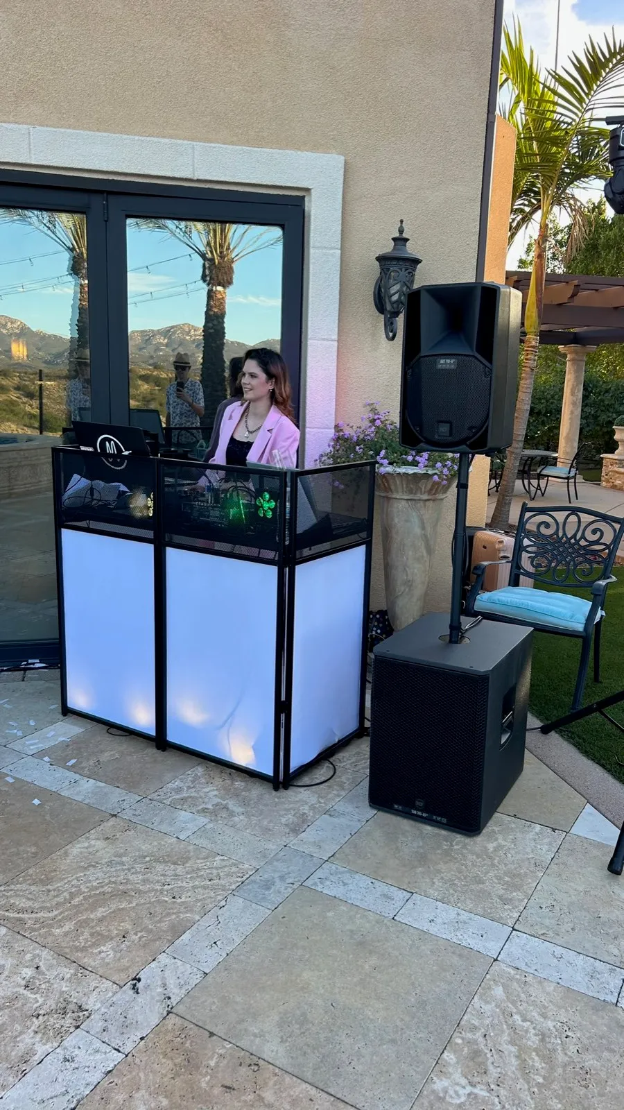 DJ booth with pro speakers and subwoofer at a Poway wedding, golden hour