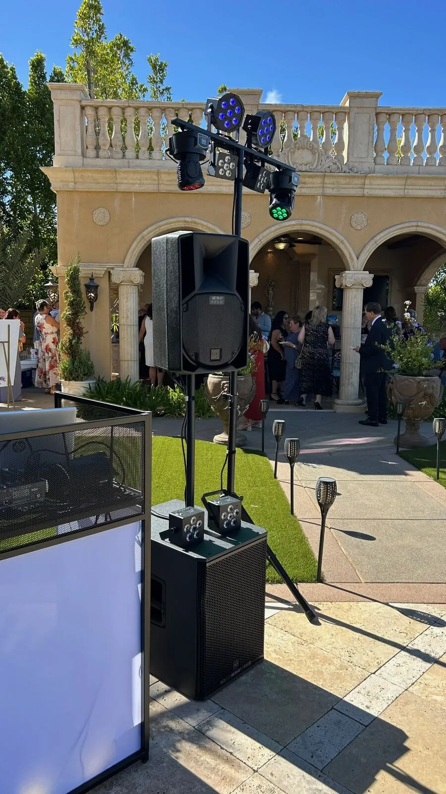 Rocket Karaoke's DJ at the lit booth on the terrace at a Poway estate wedding