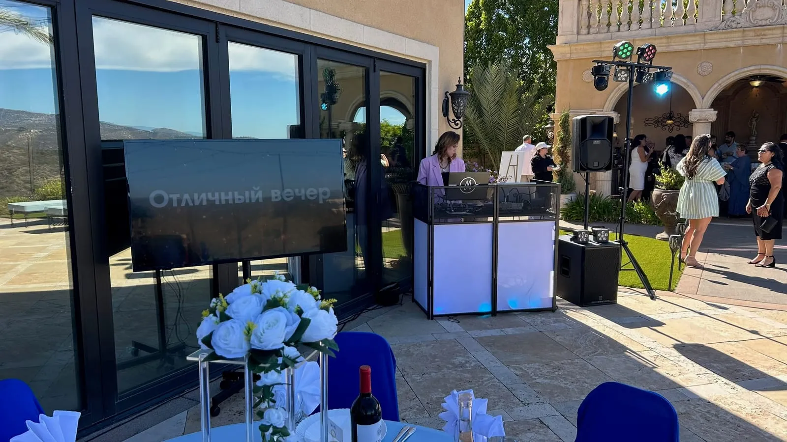 Outdoor wedding DJ setup with sound and lighting in San Diego